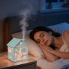 The new cross-border foreign trade wooden house humidifier features a creative seven-color ambient light, thick fog volume spray, and a desktop humidifier Application Scenario
